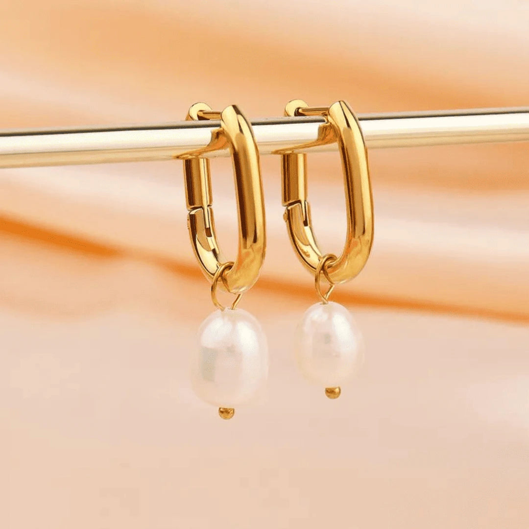 Elegant gold-plated pearl drop earrings, crafted with real S925 silver, adding a touch of sophistication to any outfit.