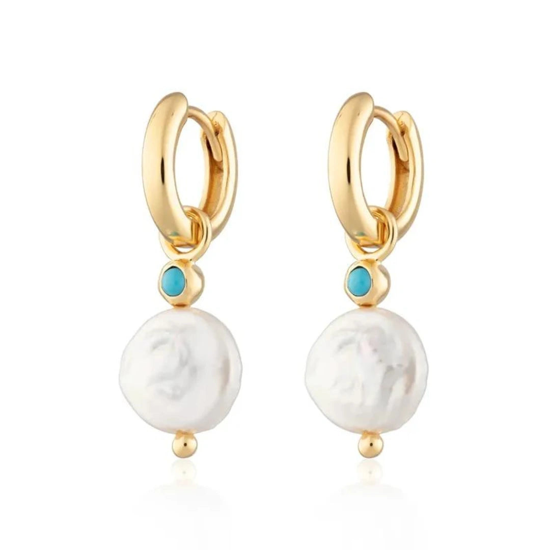 Striking "Azure Pearl Drop" earrings crafted with 925 silver, 18k gold, and captivating turquoise pearl drops, adding a touch of refinement and fashion to any ensemble.