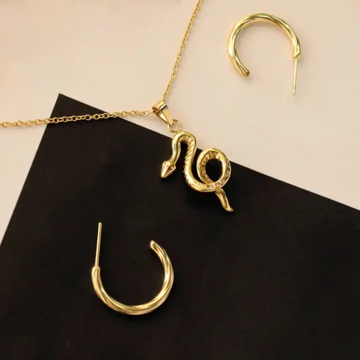 PVD 18k gold-plated snake pendant that's as unique as it is charming.