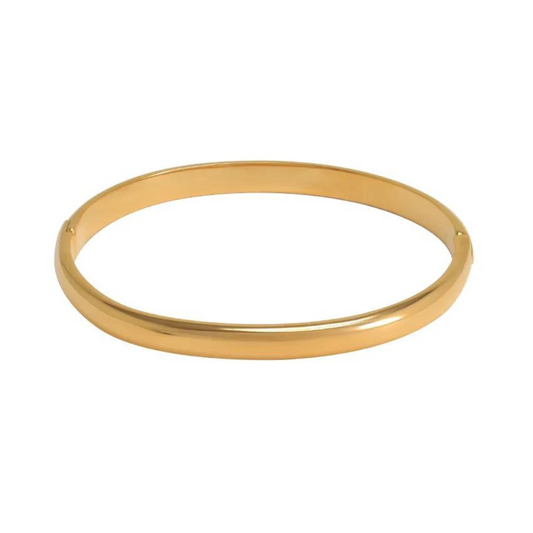 The radiant gold bangle that shines like the sun!   Crafted with exquisite detail and plated in lustrous 18K gold, our Helios bangle exudes timeless elegance.