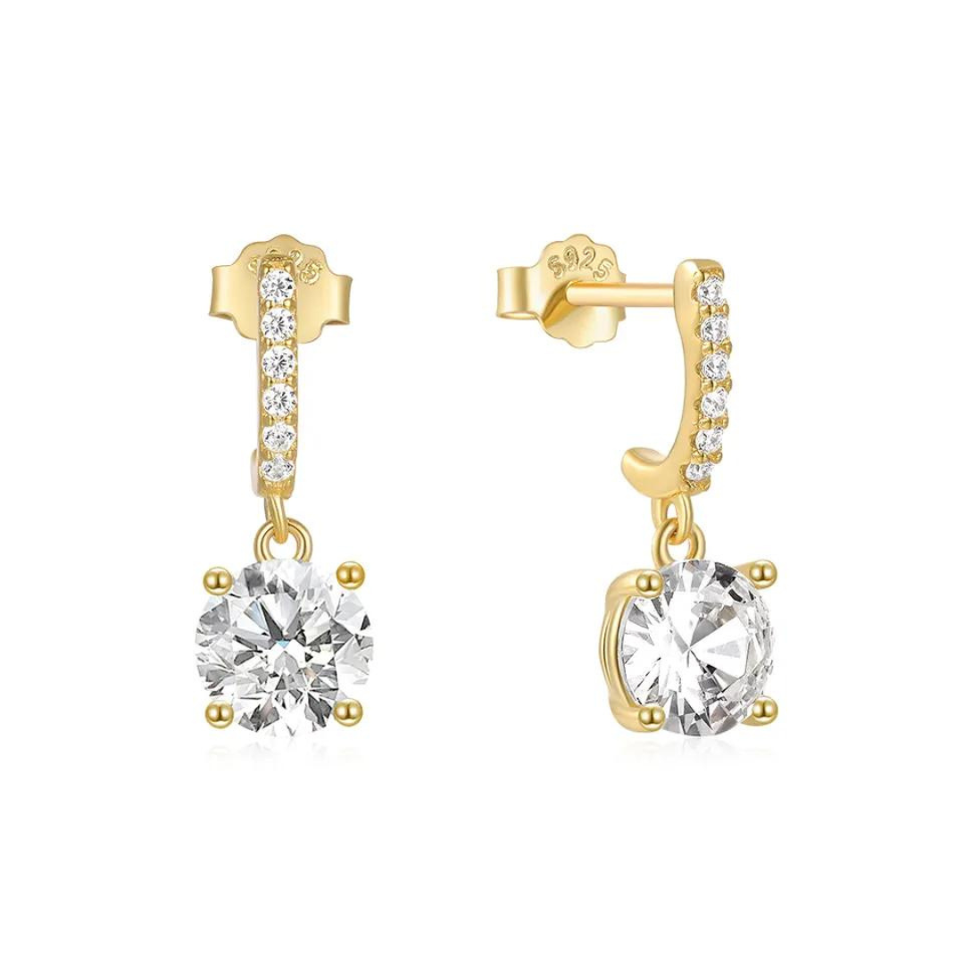 Featuring several small zircons gracefully cascading down to a stunning large zircon at the end of the drop, these earrings radiate a captivating sparkle that adds a touch of glamour to any occasion.