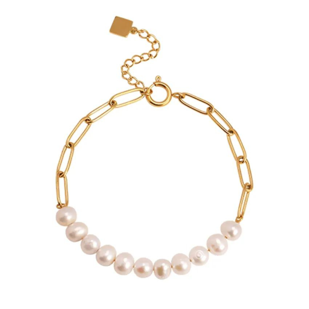 This stunning piece features a trendy paperclip chain design with lustrous freshwater pearls that create a beautiful contrast against the gold. The delicate and dainty look of this bracelet makes it perfect for stacking with other bracelets or wearing alone as a statement piece.