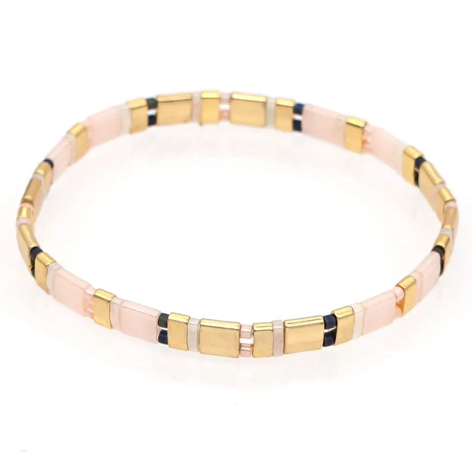 Inspired by the beautiful pink sands of palm beach this stunning stretch tila bead bracelets is set in pale pink, gold with a touch of black and pearl. Tila glass bead stretch bracelet