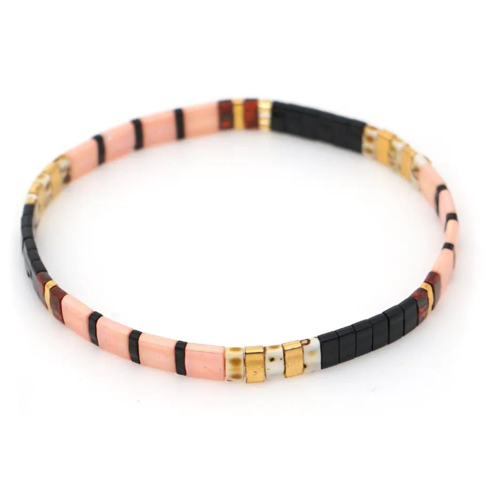 Inspired by the beautiful pretty beach  Stunningly designed in peach coral, turtle shell and gold.  Stretch bracelet made of the finest glass tila beads.