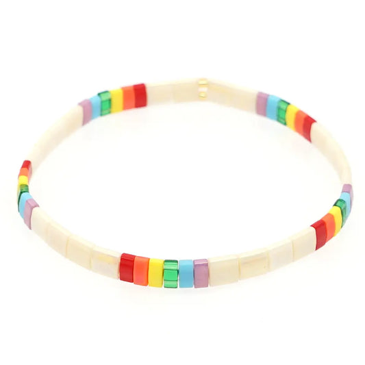 Beautiful stretch beaded tila bracelet.  Pearl coloured with sections of brightly coloured rainbow beads.