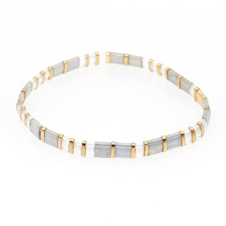 Inspired by the sophistication of  San Tropez. Stunningly designed in silver, pearl and gold.  Stretch bracelet made of the finest glass tila beads.