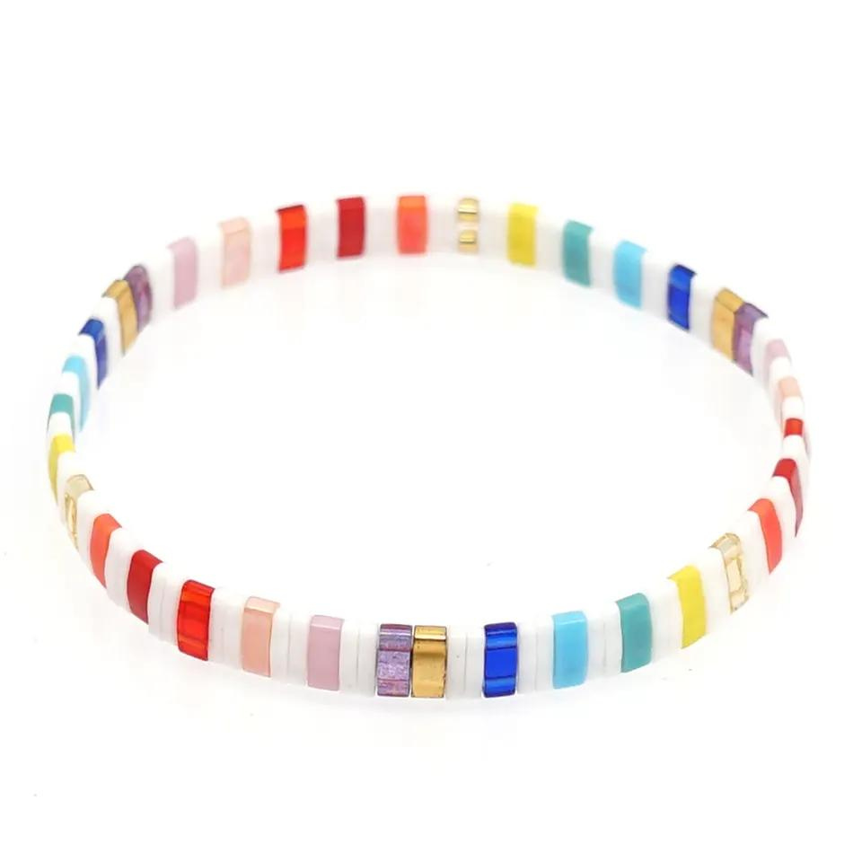 Inspired by the rainbow tower at Waikiki beach this is a beautiful rainbow coloured stretch tila bead bracelet in a playful design. Tila glass bead stretch band