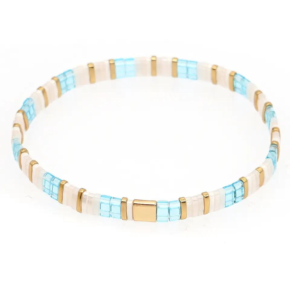 Inspired by the beautiful Whitsundays Stunningly designed in aqua, coral, and gold.  Stretch bracelet made of the finest glass tila beads..  Tila glass bead stretch bracelet