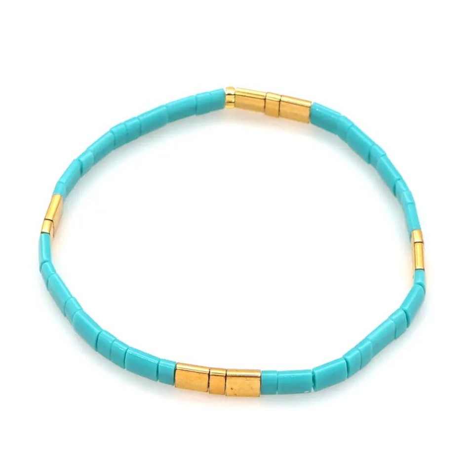 Inspired by the Island of Zakynthos, stunning stretch beaded bracelet.  Made from the finest tila beads which shine in aqua and gold. Tila glass bead stretch band