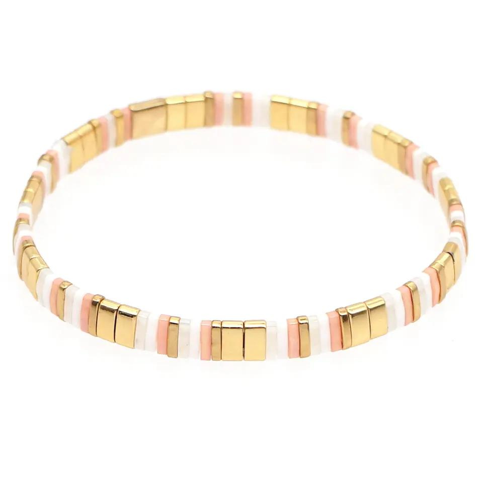 Inspired by the beaches of Zanzibar. This stunning stretch beaded bracelet is made from the finest tila beads which shine in pinks, pearls and gold. Tila glass bead stretch band